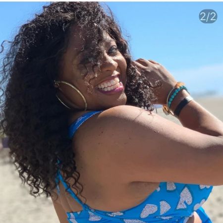 Sherri Shepherd in a blue top poses a picture.